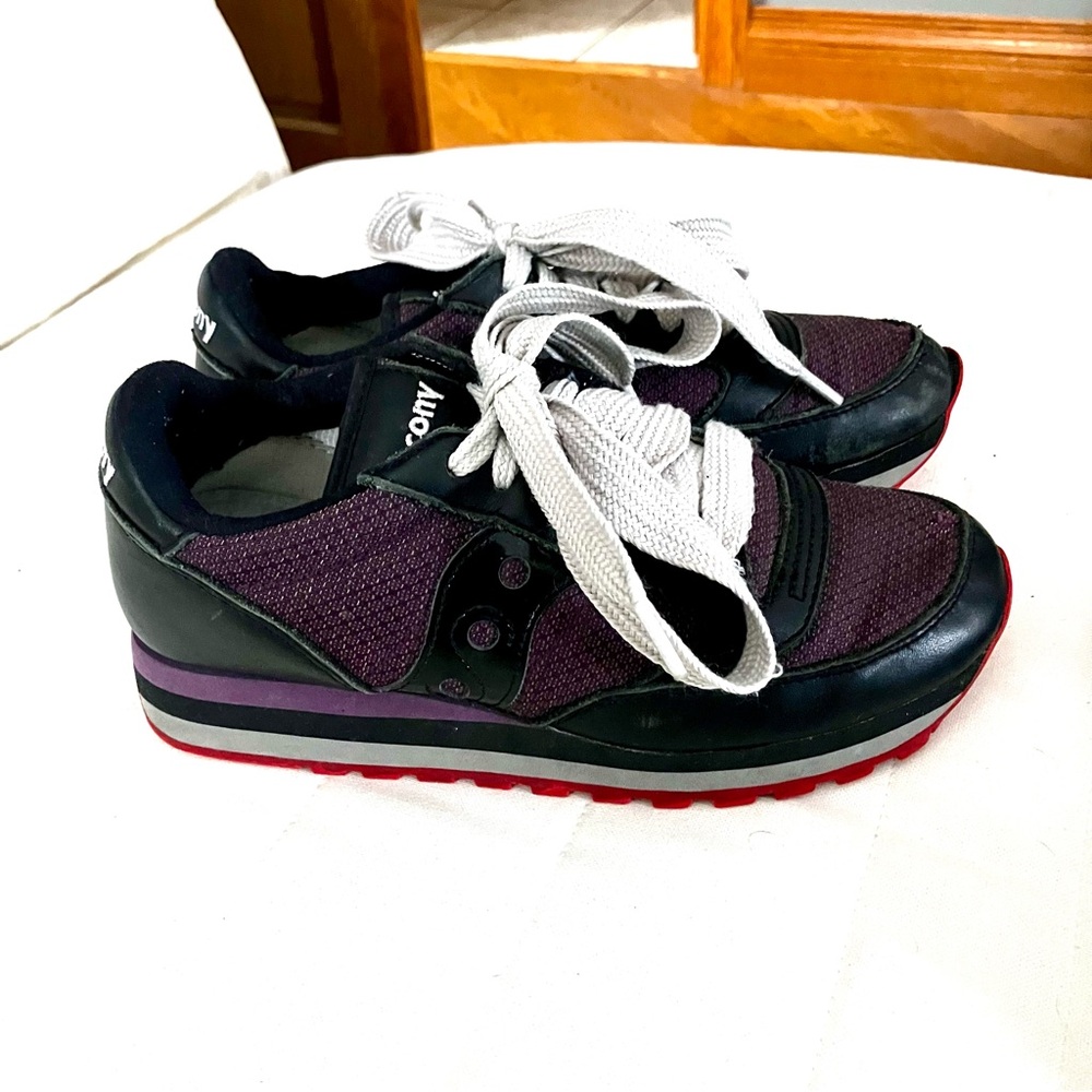 Saucony Jazz Triple sneakers/ Purple material, black leather.Cool red souls too!